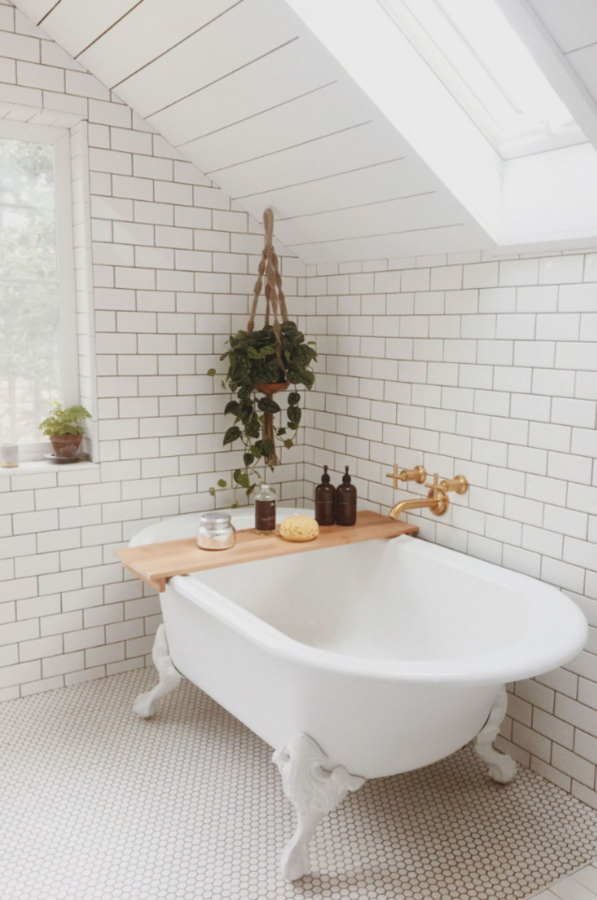 Tile work covers most bathrooms. Source: Country Living