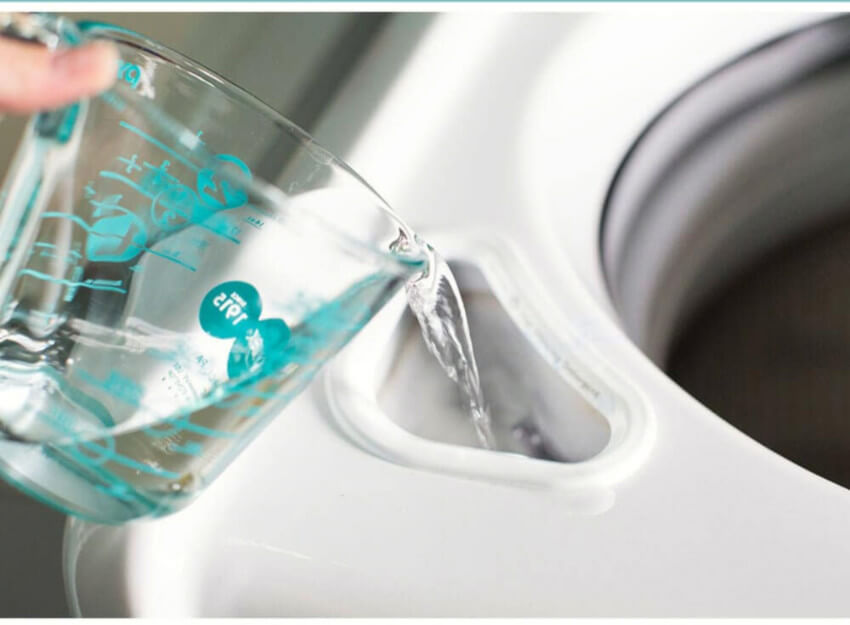 Vinegar and water will make a nice cleaning solution for your washing machine.