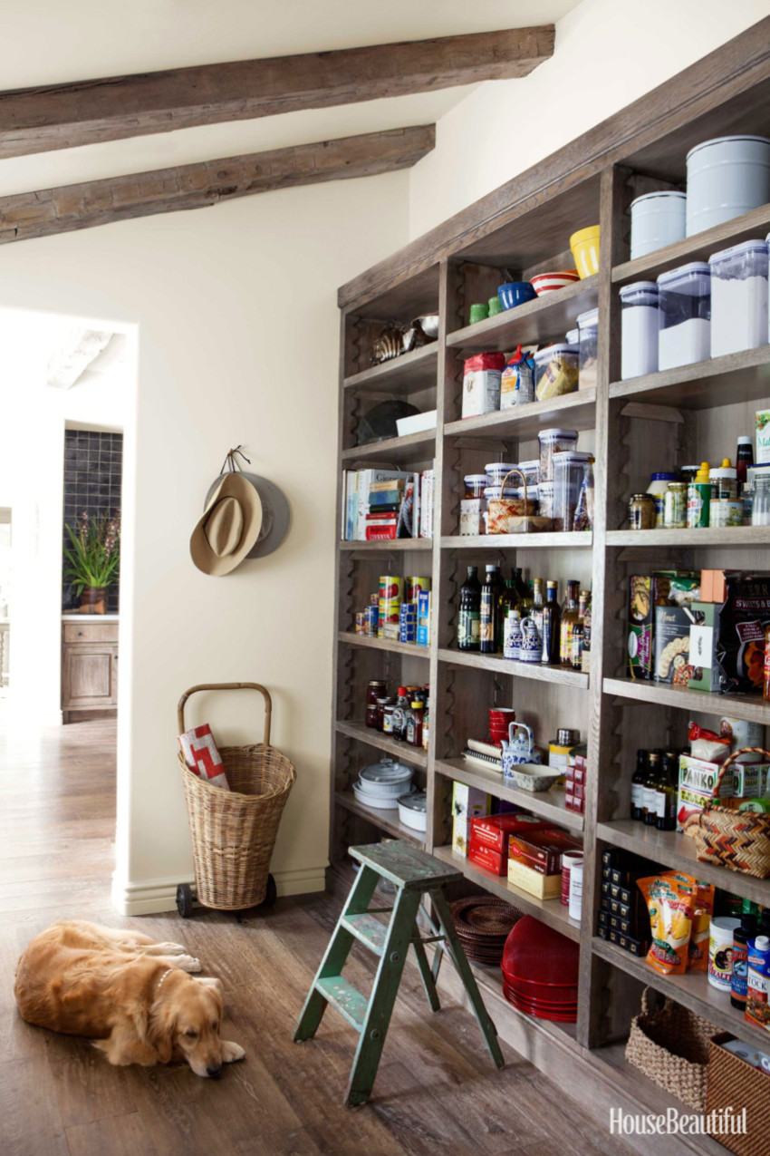 Use an entire wall as pantry space. Source: House Beautiful