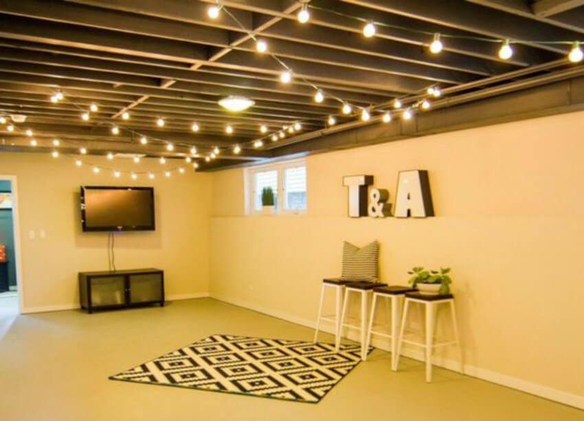 Hanging lights will give a special charm in an unfinished basement
