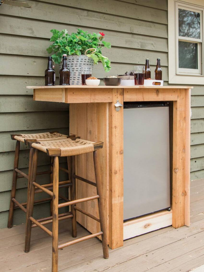 An awesome DIY minibar with fridge and seating! Source: HGTV