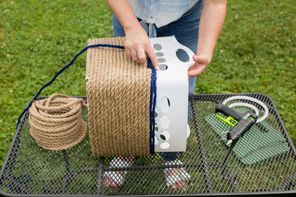 Use a hot glue gun to secure the jute in place. Source: HGTV