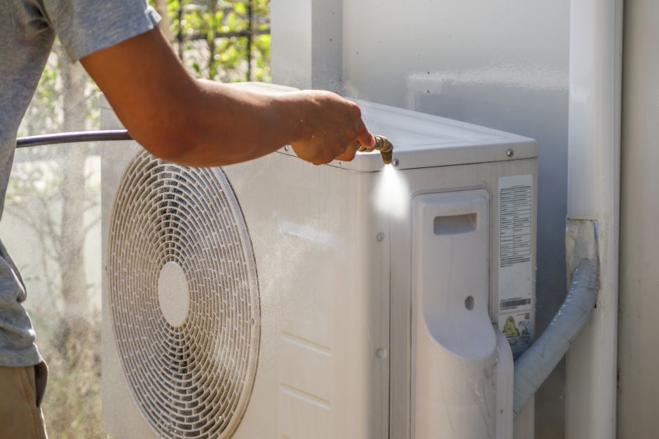 Image showing the process of cleaning an air conditioner.