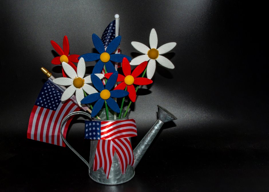 Table floral arrangement with american patriotic flags for labor day