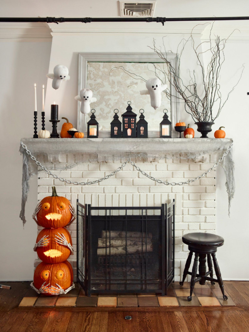 Build a spooky town over the mantle. Source: Woman’s Day