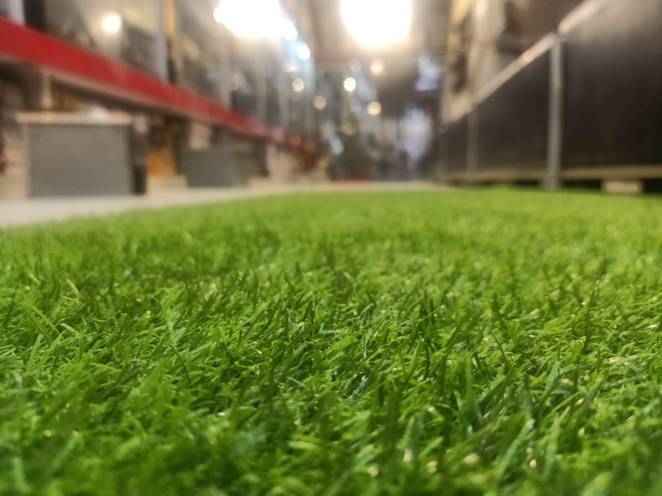 Zoom in on artificial grass in an indoor setting