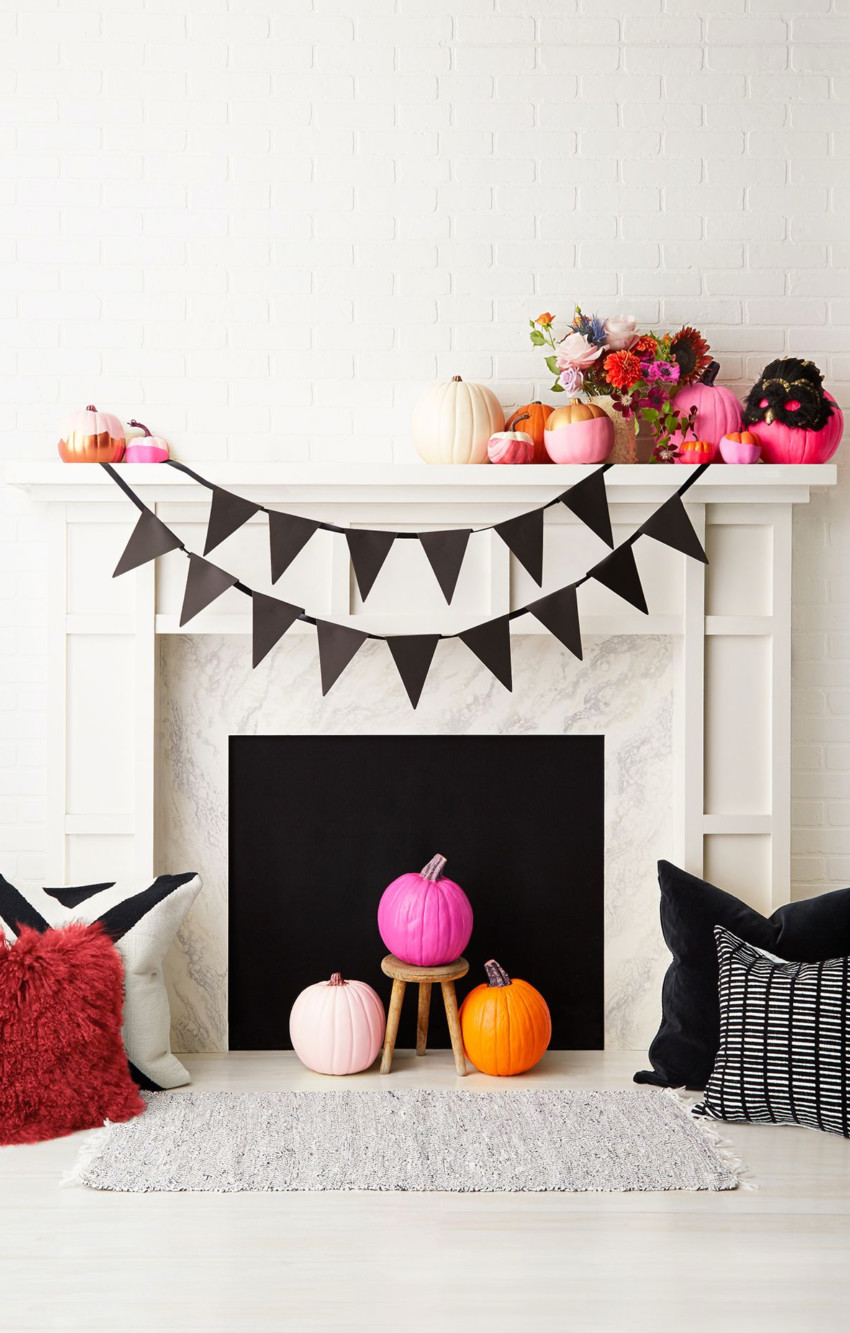 Decorate for Halloween to refresh your mantle with a new look. Source: Good Housekeeping