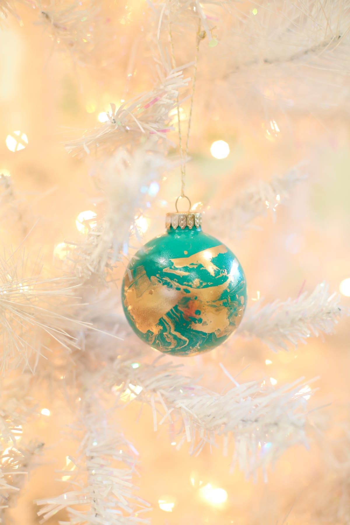 Give your ornaments a splatter of gold. Source: Lovely Indeed